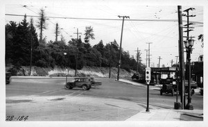 Looking northeasterly across Sunset Boulevard from Bellevue Avenue showing new automatic signal erected in center of intersection, Los Angeles, 1928