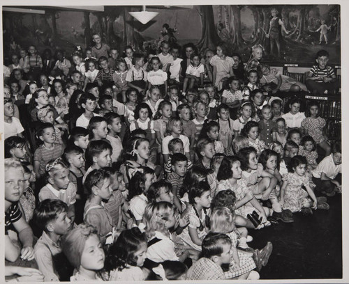 Children watching a performance in the Boys and Girls Room