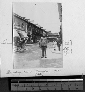 Sikh police officer on corner, Shanghai, China, 1900