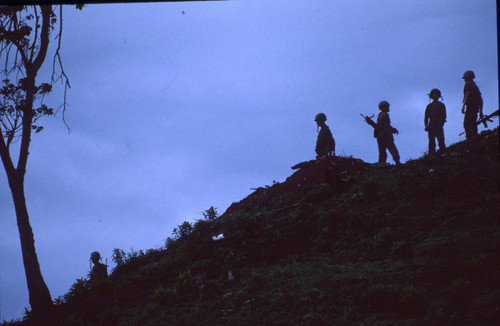 Soldiers stand on hill, Honduras, 1983
