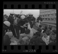 Police grabs protester at Century Plaza Hotel during Pres. Johnson's visit. 1967