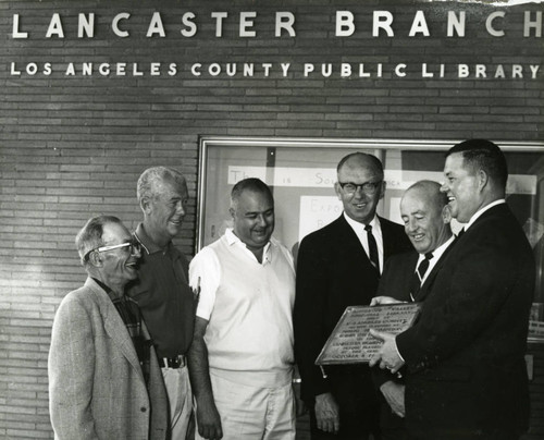 Removal of the 1950 Lancaster Library plaque from the Fig Avenue library location, Lancaster, California