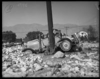 Wreckage of a car along a highway after flooding due to record rainfall, La Crescenta-Montrose, 1934