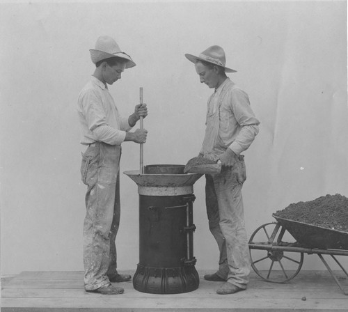 Gardner Pipe Works workers making a concrete pipe , Orange, California, ca. 1902