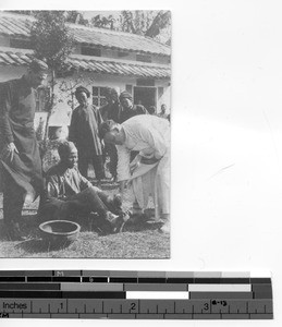 Fr. Dietz and Bro. John tending to dispensary patients at Dongzhen, China, 1925