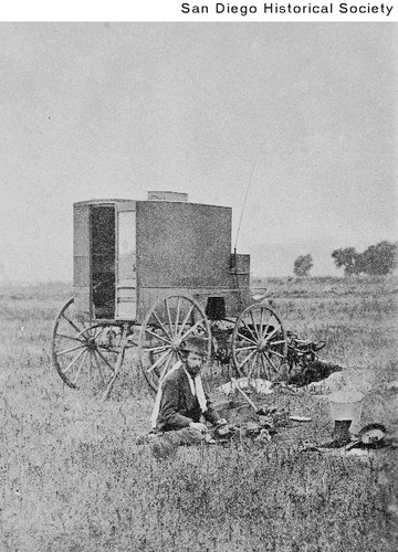 Photographer W. A. Vale working next to his wagon