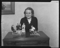 Marion Eastman with her paper doll display, Santa Anita, 1935