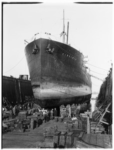 Ship under construction "on the ways" of the Larsen Ship Building Company at Los Angeles Harbor, showing the bow of the ship, 1928