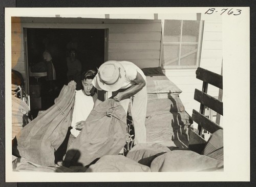 Back of post office at Poston--a branch office of the Phoenix post office--showing sacks of mail ready to be taken into the office and sorted for delivery. Four tons of Sears Roebuck catalogues arrived at this office during the week of August 24. Photographer: Brown, Pauline Bates Poston, Arizona