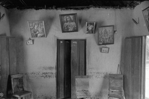 Room with paintings hanging from the wall, San Basilio de Palenque, 1976