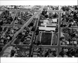 Aerial view of City Hall area of Petaluma, California, showing English, Bassett, Howard, Post, and Upham Streets, 1973