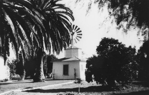 Building with windmill on the Rowland Ranch