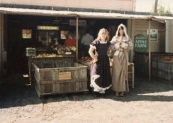 Donna Hallberg (Hallberg-Marovich and Marcia Hallberg in vintage costumes at the Hallberg Apple Farm roadside stand 1982