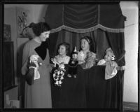 Margaret Lowry and her daughters, Marilyn, Joan, and Patricia, perform a puppet show, Los Angeles, 1935