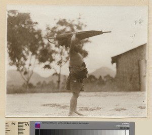 Child with umbrella, Mihecani, Mozambique, ca.1925