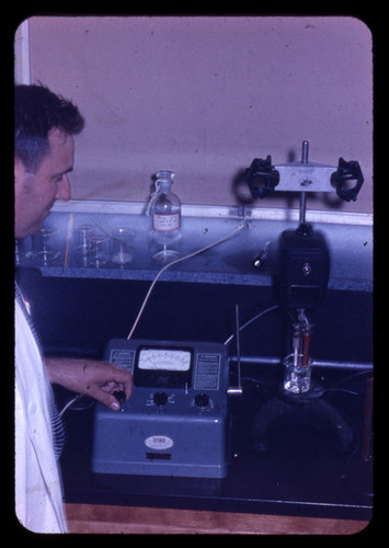 Man in lab with Beckman meter