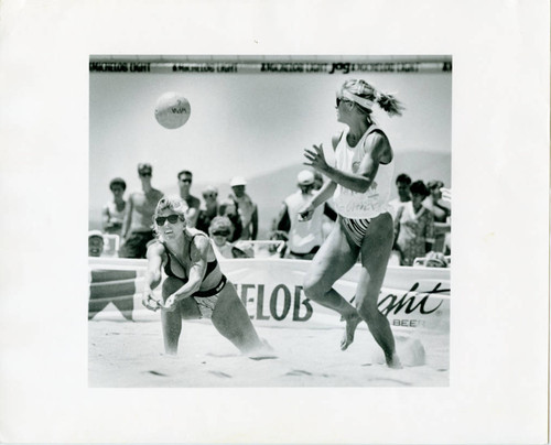 Lori Kotas and Gail Castro play sand volleyball, 1990s