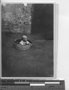 A child in the flood at Wuzhou, China, 1936