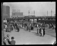 Crowd gathers at a train station to either welcome or bid farewell to Aimee Semple McPherson, Los Angeles, about 1926