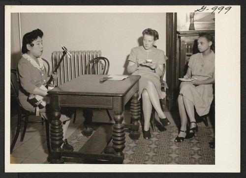 Entertaining guests at the housewarming party of the new Manhattan Hostel for Japanese Americans on November 23, 1945, is Mrs
