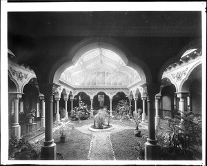 Interior view of Gail Borden residence in Alhambra, showing small garden, ca.1903