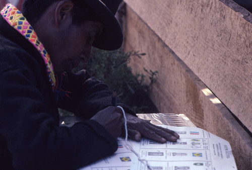 Mayan man filling out his ballot, Nahualá, 1982