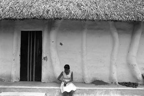Woman crafting outside, La Chamba, Colombia, 1975