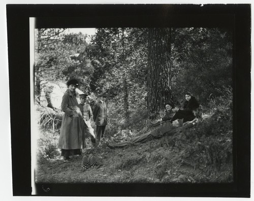 Ed Fletcher with unidentified companions, in woods
