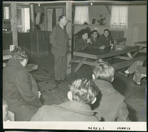 Robert Cozzens, Deputy Assistant Director, San Francisco, addressing a meeting of male, draft-age citizens