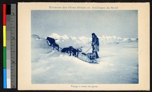 Man leading a dog sled over the snow, Canada, ca.1920-1940