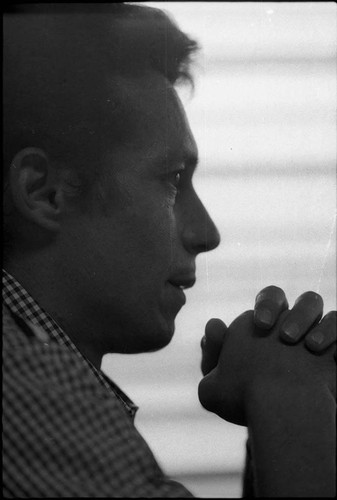 Side profile of Roberto D'Aubuisson with his hands clasped, San Salvador, 1982
