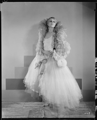 Peggy Hamilton modeling an Adrian tulle evening gown, 1929
