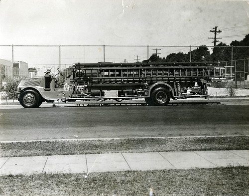 Coronado Fire Department’s 1928 Mack quadruple combination fire engine parked at an unknown location, circa 1935