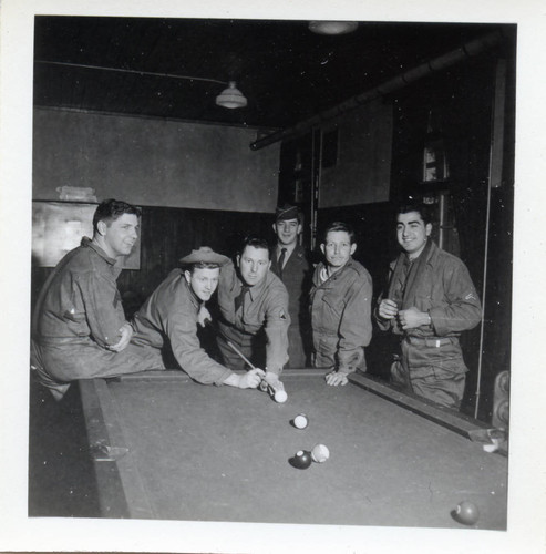 Army men playing pool