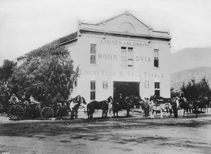 Horses and their owners outside of the Cornes and Slosson Stable in Monrovia, Los Angeles, 1892