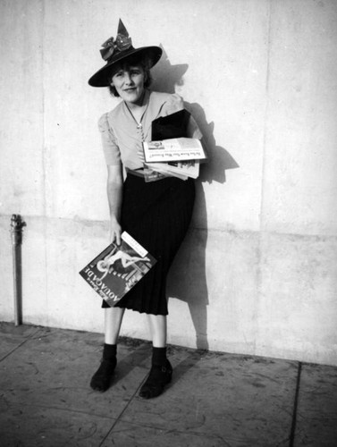 Ethel Schultheis holding magazines
