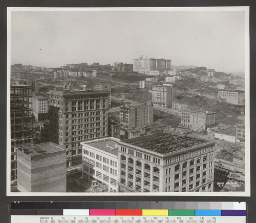 [Cityscape from above circa Kearny and Post Sts. looking northwest toward Nob Hill. Fairmont Hotel in distance, center.]