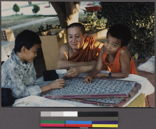 Buddhist monk with two boys, Ceres, California