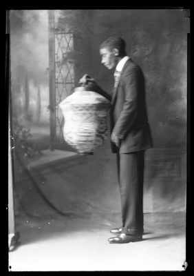 E.F. Joseph holding a Chinese lantern