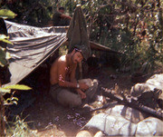Photograph by Gustafsson of A Fellow Soldier Sitting by His Tent