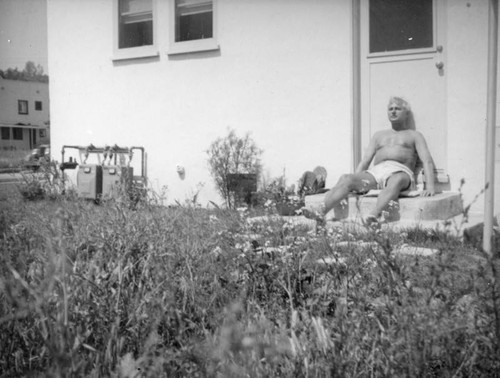 Herman Schultheis on the steps at home