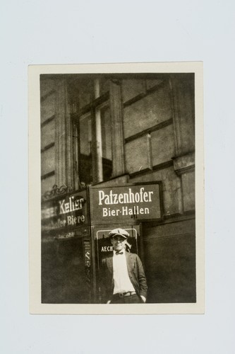 United States Olympic Rugby Team member Rudolph "Rudy" Scholz standing in front of Patzenhofer Bier-Hallen