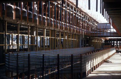 Interior view of Administration Building construction; framing around the parapet of the mall; part of the Frank Lloyd Wright-designed Marin County Civic Center, San Rafael, California, circa 1960 [photograph]