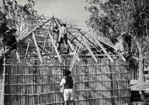 Construction of the roof of the evangelist's house by people in charge of the Youth