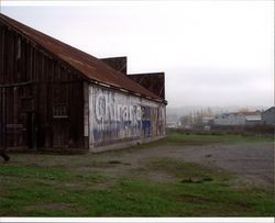 Left side of livery stable at Steamer Landing Park, Petaluma, California, showing painted Ghirardelli sign, Nov. 18, 2004