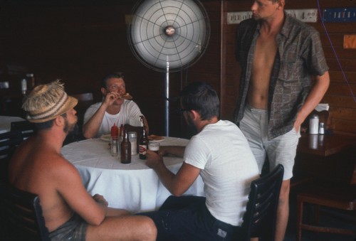 During a break from the Swan Song Expedition (1961) a member of the crew took this photo of other crew members enjoying a beer in Acapulco, Mexico.1961