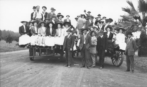 Church picnic group in hay wagons en route to Orange County Park, Orange, California, 1909