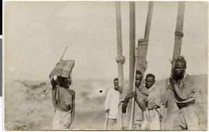 Carriers of wooden beams, Ethiopia, 1929