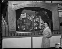 Woman poses in front of the General Foods exhibit at the Food and Household Show, Los Angeles, 1933