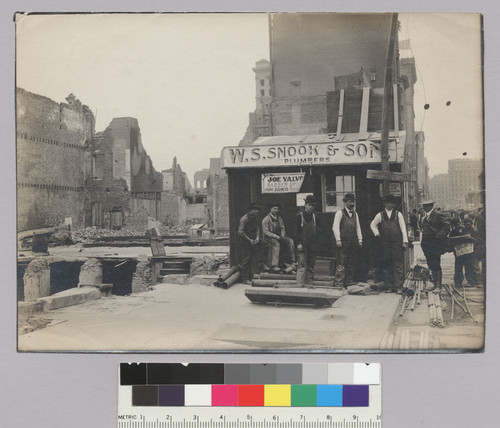 San Francisco in ruins, April 1906. East side Montgomery St. (600 block) at corner of Clay St. [Makeshift office of W.S. Snook & Son, Plumbers; Joe Valvo barber shop.]
